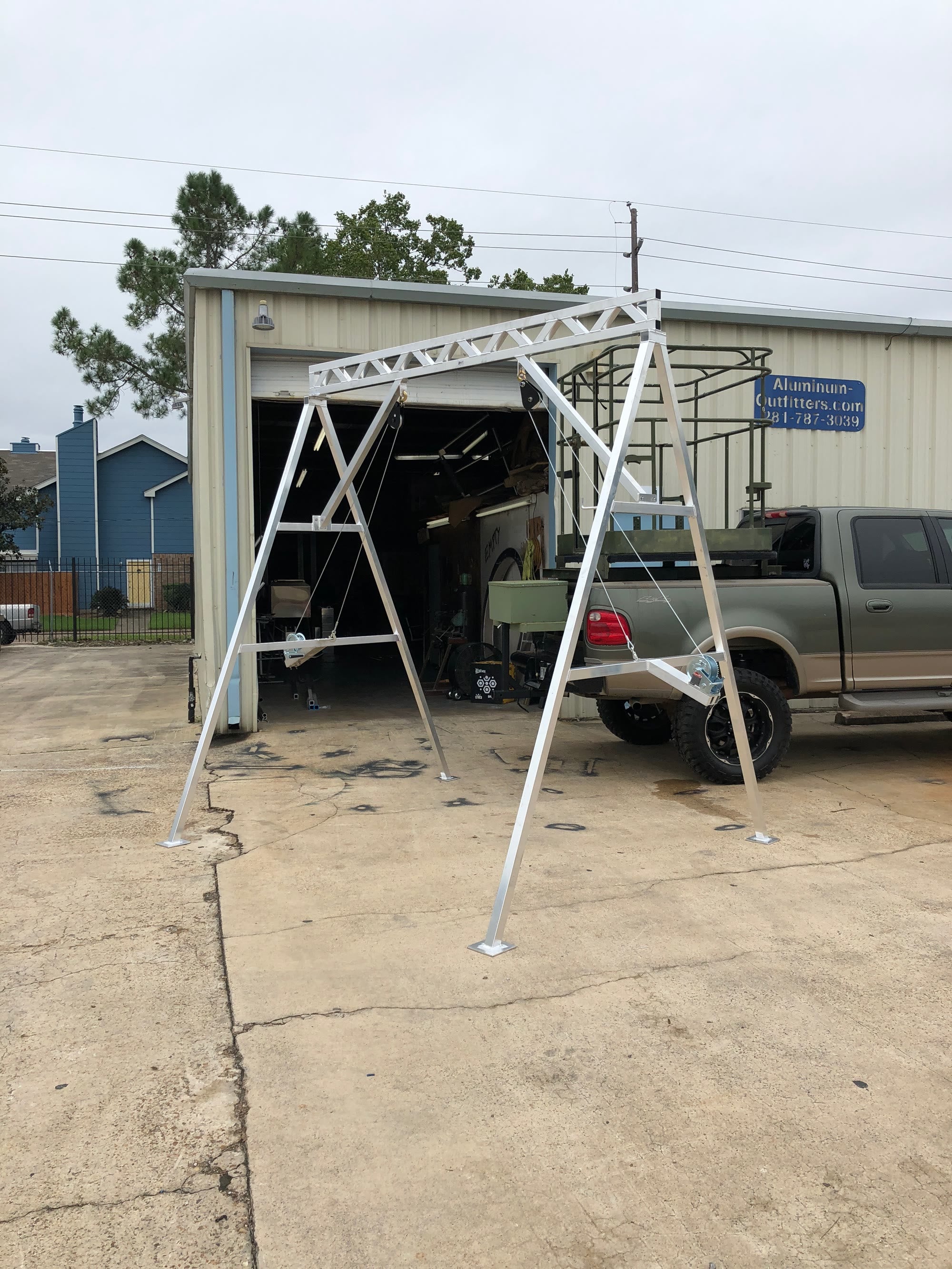 Aluminum A-frame skinning rack, eleven feet tall.